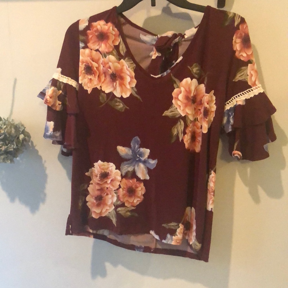 s maroon blouse with floral pattern